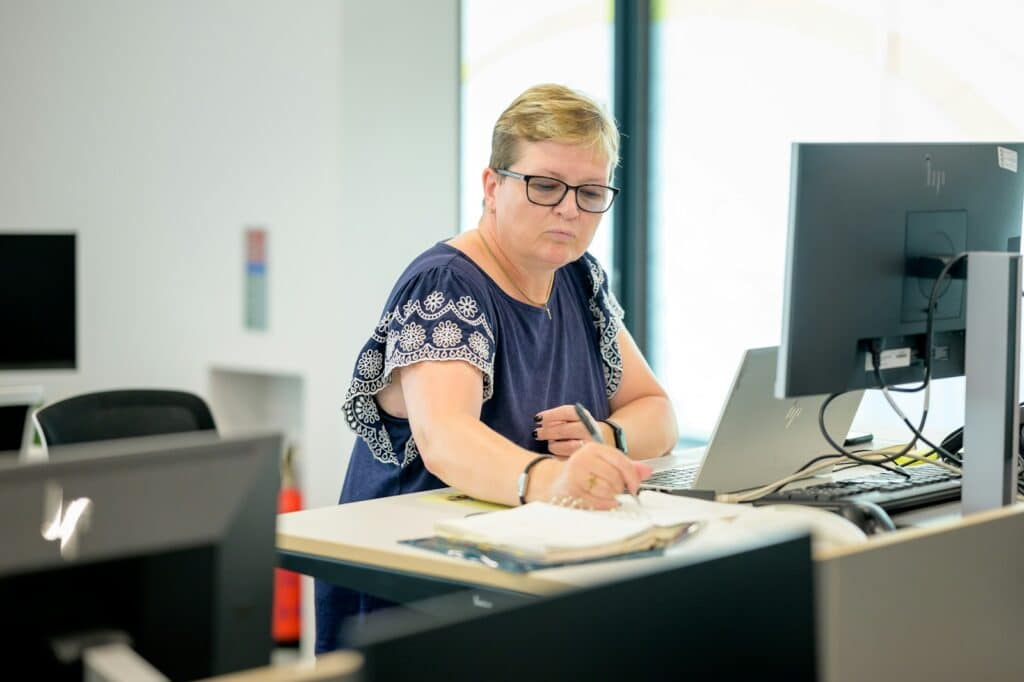 Top Bookkeeping Services for Small Businesses 7 a person sitting at a desk